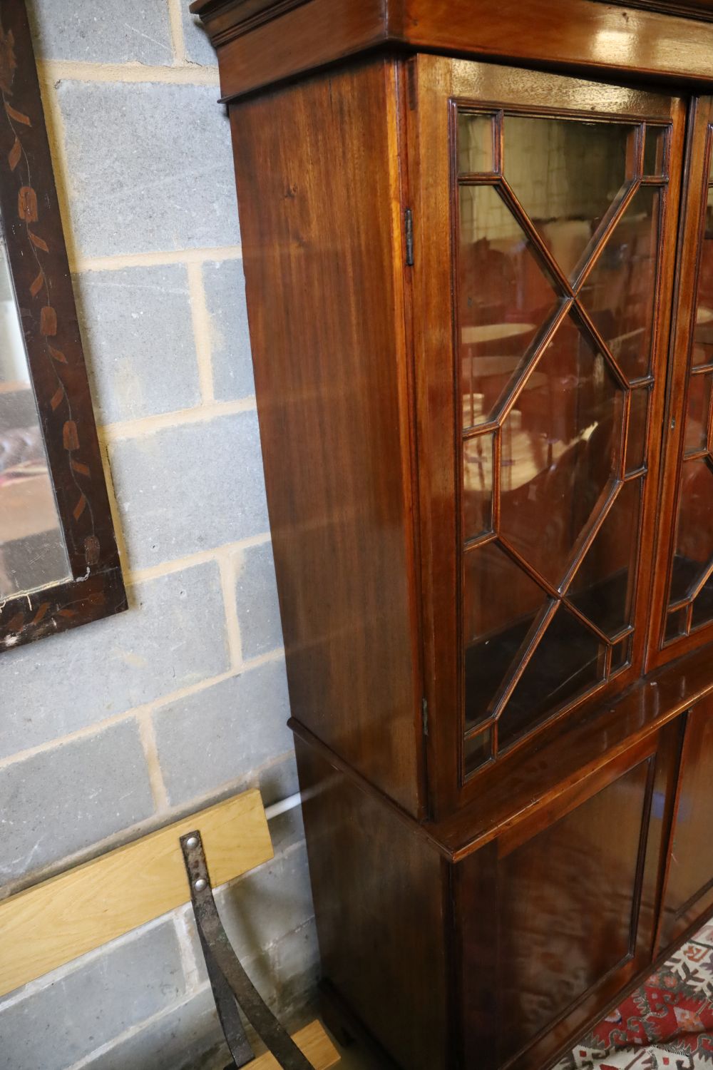 A Georgian style mahogany glazed bookcase, width 116cm, depth 44cm, height 194cm
